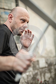 Eskrima and kapap instructor demonstrates machete weapon fighting technique