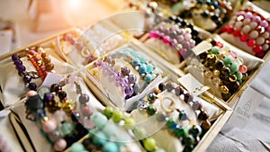 Esoteric and colorful background. Gemstone bracelets and necklaces. Healing, powerful crystal and stones  energy.