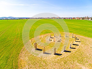 Esoteric geomancy symbol in green wheat field.