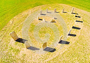 Esoteric geomancy symbol in green wheat field.