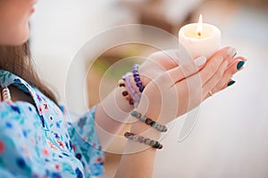 Esoteric in a magic candle close-up and copy space. Fortune telling by a candle