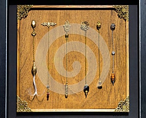 Esoteric magic pendulum. Vintage symbol of esoterism, withcraft and fortune-telling photo