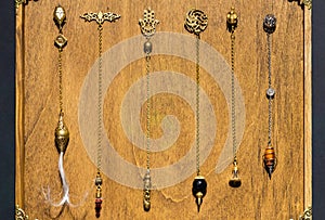 Esoteric magic pendulum. Vintage symbol of esoterism, withcraft and fortune-telling photo