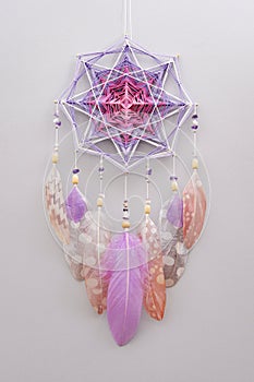 Esoteric woven mandala magical dreamcatcher  on grey background