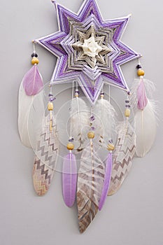 Esoteric woven mandala magical dreamcatcher  on grey background