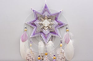 Esoteric woven mandala magical dreamcatcher  on grey background