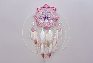 Esoteric woven mandala magical dreamcatcher  on grey background