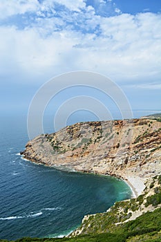 Especial Cape. Portugal. Atlantic ocean beach. Blue sky. Clouds. Waves. Wonderful bright light travel. Beautiful view. Landscape. photo
