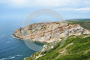 Especial Cape. Portugal. Atlantic ocean beach. Blue sky. Clouds. Waves. Wonderful bright light travel. Beautiful view. Landscape. photo