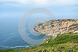 Especial Cape. Portugal. Atlantic ocean beach. Blue sky. Clouds. Waves. Wonderful bright light travel. Beautiful view. Landscape. photo