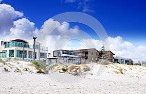 Esplanade homes and street houses overlooking beautiful white sandy beach