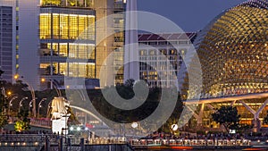 The Esplanade Theatres on the Bay in Singapore at dusk, with beautiful reflection in water day to night timelapse