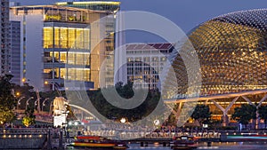 The Esplanade Theatres on the Bay in Singapore at dusk, with beautiful reflection in water day to night timelapse