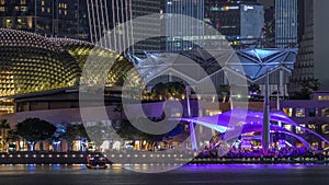 The Esplanade Theatres on the Bay in Singapore at dusk, with beautiful reflection in water night timelapse