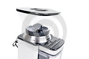 Espresso bean coffee grinder. Brand new clean machine over white, close up of hopper left side