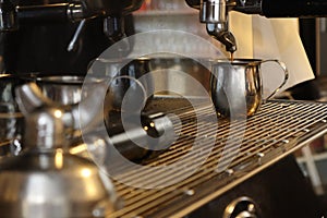 Espresso being made by barista on espresso machine