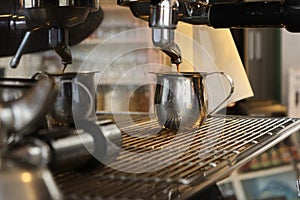 Espresso being made by barista on espresso machine