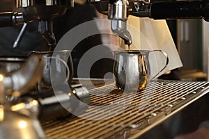 Espresso being made by barista on espresso machine