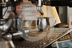 Espresso being made by barista on espresso machine