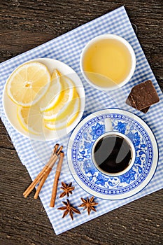 Espresso in blue cup with lemon and honey on the table
