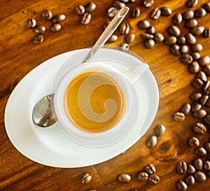 Espresso , coffee beans , water on table