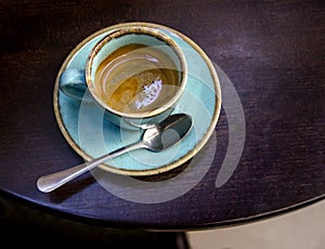 Espresso coffee in a beautiful turquoise ceramic cup