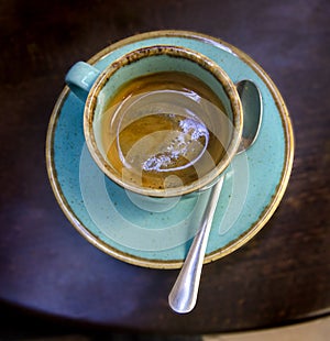 Espresso coffee in a beautiful turquoise ceramic cup