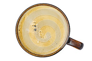 Espresso coffee in a ceramic cup on a white background top view
