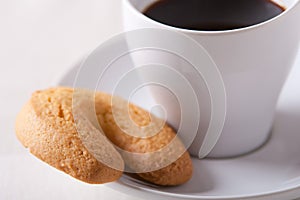 Espresso coffee cup with a biscuit on the saucer