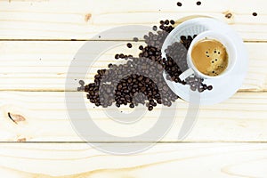 Espresso Coffee cup and coffee beans on wooden table