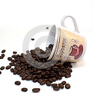 Espresso coffee cup spilling coffee beans