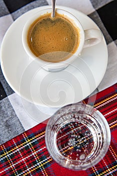 Espresso coffee cup top view served with mineral water photo