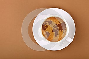 Espresso coffee cup with world map on table