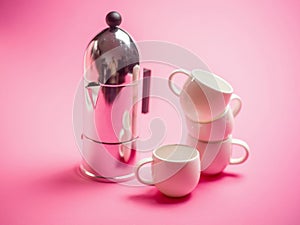 Espresso coffee cups over a pink background