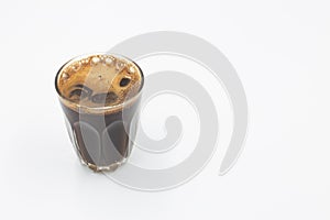 Espresso coffee in glass cup isolated on white background