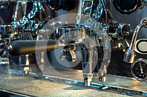 Espresso coffee machine in shop with customer blurred background