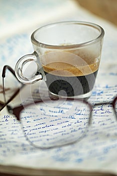 espresso coffee on an old manuscript