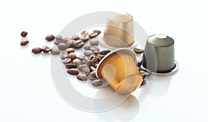 Espresso coffee pods and coffee beans on white background, Closeup view with details
