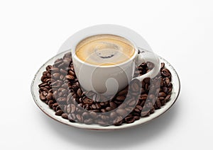 Espresso coffee in small cup and fresh raw beans on saucer on white background