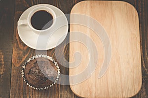 espresso cup, chocolate muffin and wooden tray with copy space/espresso cup, chocolate muffin and wooden tray with copy space. Top