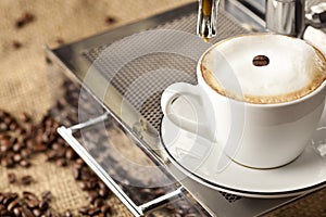 Espresso cup full with coffee beans