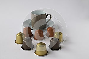 Espresso cup and saucer with coffee pods
