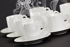 Espresso cups with steaming hot coffee