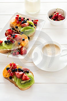 Espresso and fruit dessert sandwiches with ricotta cheese, kiwi, apricot, strawberry, blueberry and red currant