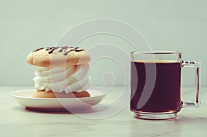 Espresso glass and dessert on white marble background/Espresso glass and dessert on white marble background. Selective focus
