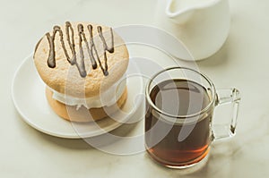 Espresso glass with milk and dessert / Espresso glass with milk and dessert on white background. Selective focus