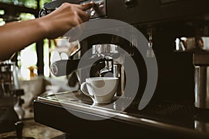 espresso machine in coffee shop counter offering freshly brewed coffee. coffee maker concept