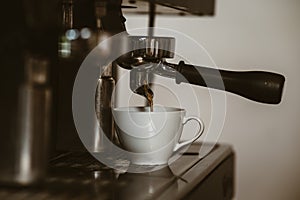 espresso machine in coffee shop counter offering freshly brewed coffee. coffee maker concept