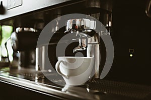 espresso machine in coffee shop counter offering freshly brewed coffee. coffee maker concept