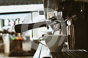 espresso machine in coffee shop counter offering freshly brewed coffee. coffee maker concept